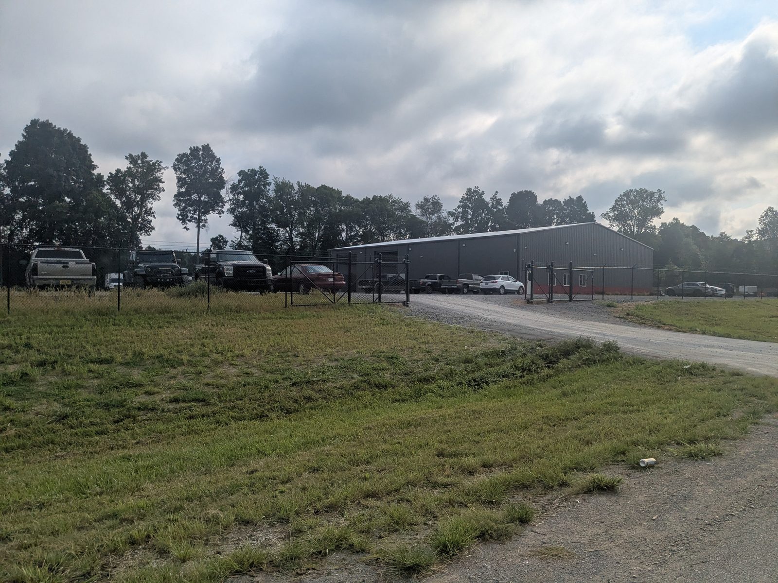 Galvanized commercial chain link fence securing a business lot